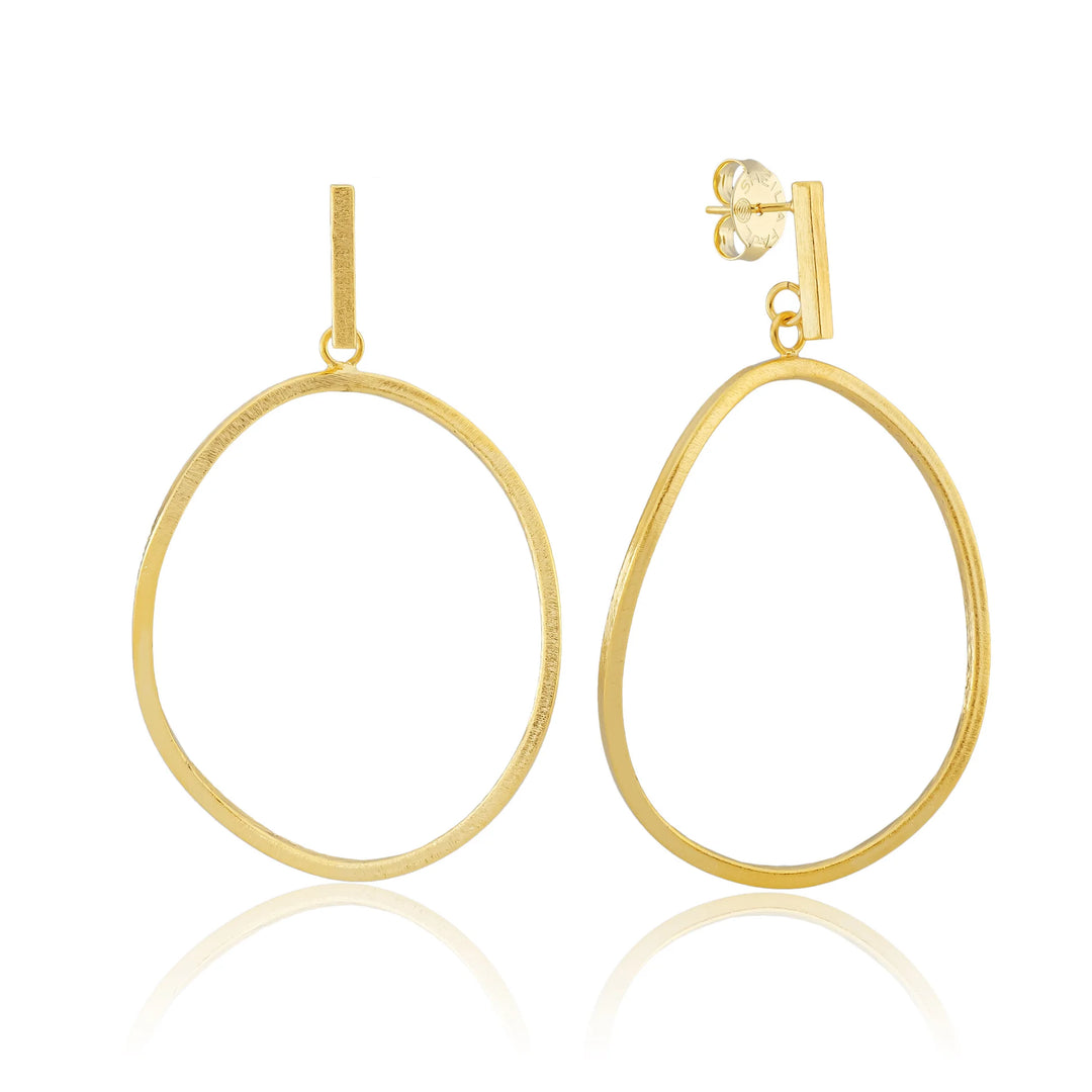 Gold hoop earrings on a white background