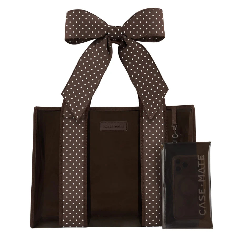 A brown tote bag with white polka-dot handles and a matching clear phone case with a large bow, both branded CASE-MATE, shown on a plain white background.
