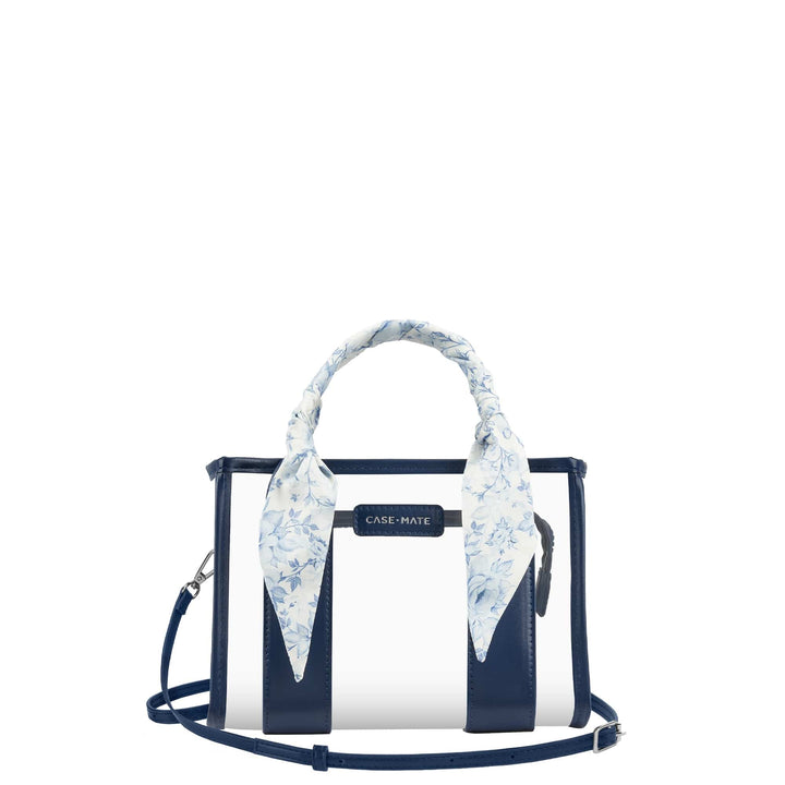 A Case-Mate structured handbag with a white and navy blue striped design, featuring a light blue and white floral patterned scarf tied around the top handle, set against a plain white background.