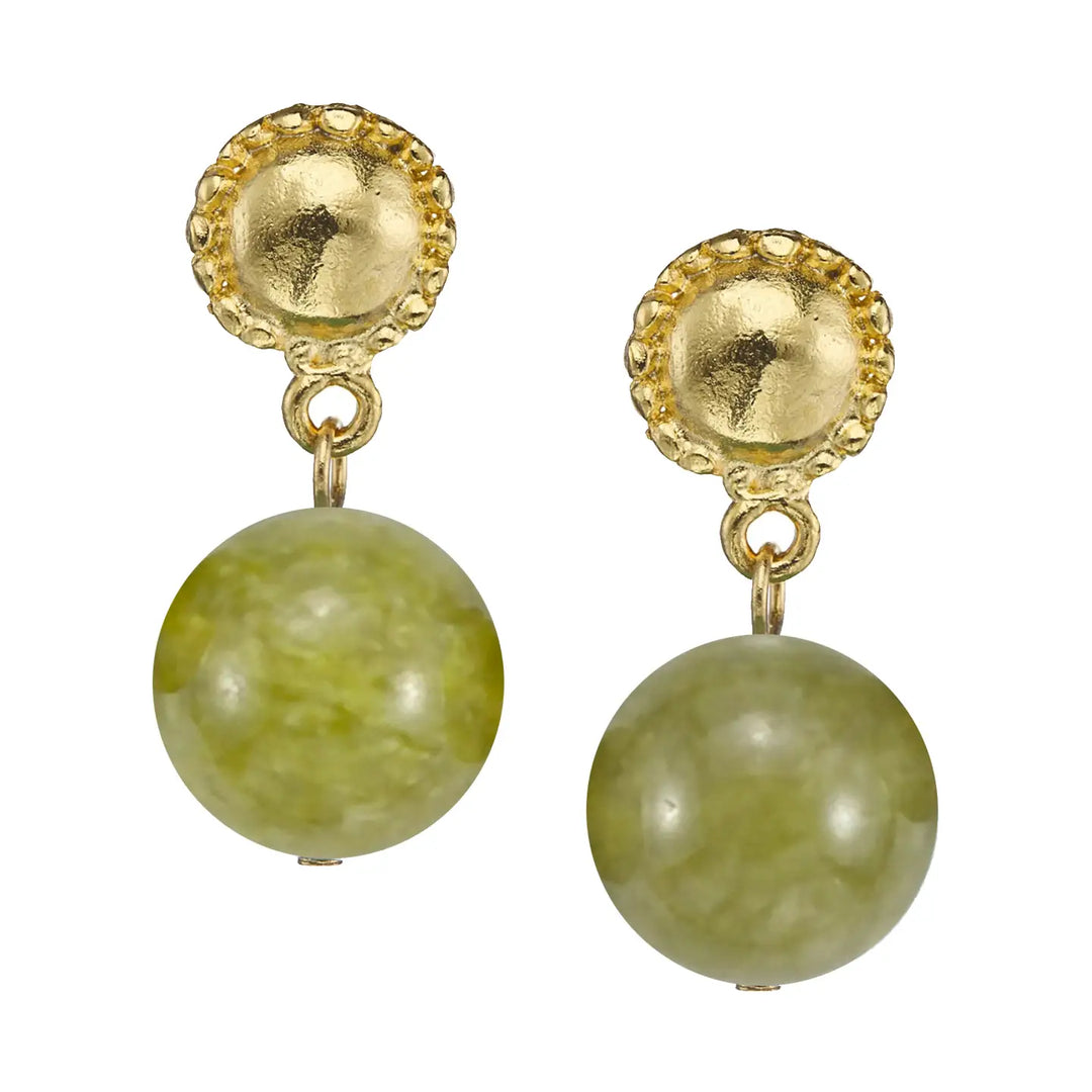 A pair of gold drop earrings featuring a scalloped circular gold top and a dangling round light green stone bead, shown on a plain white background.