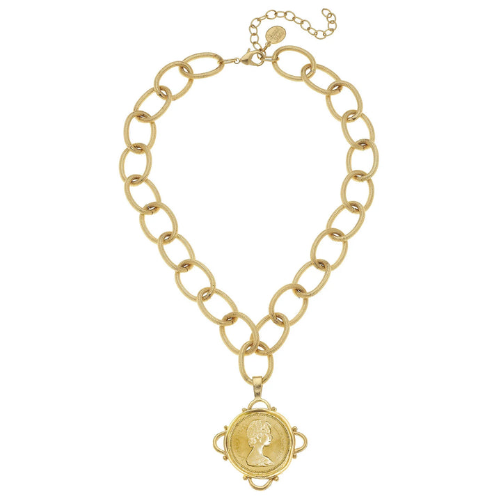 Gold chain necklace with a pendant on a white background