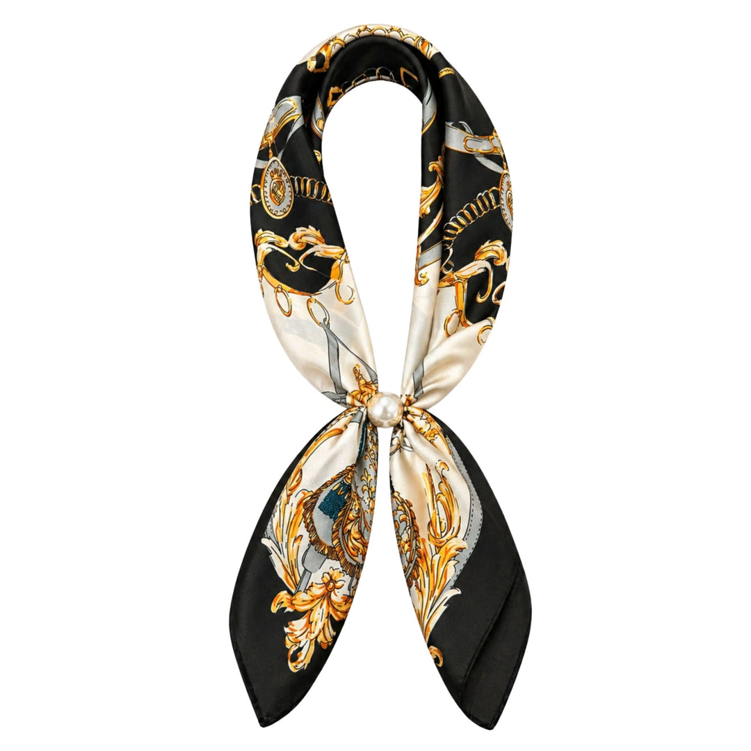 Decorative scarf with black, gold, and white pattern on a white background
