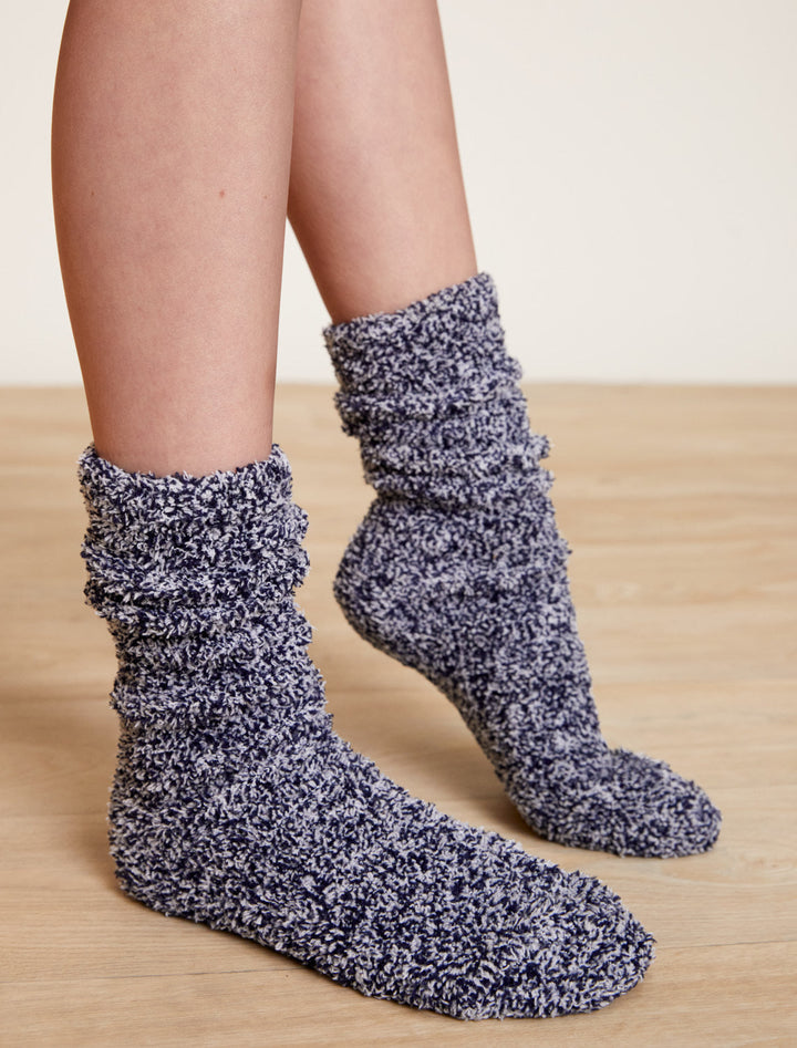 Pair of textured socks on a wooden floor