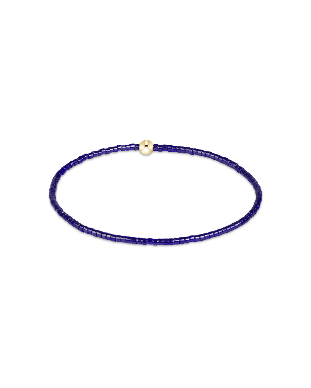 A delicate beaded bracelet made of small dark blue beads with a small gold clasp, displayed on a clean white background.