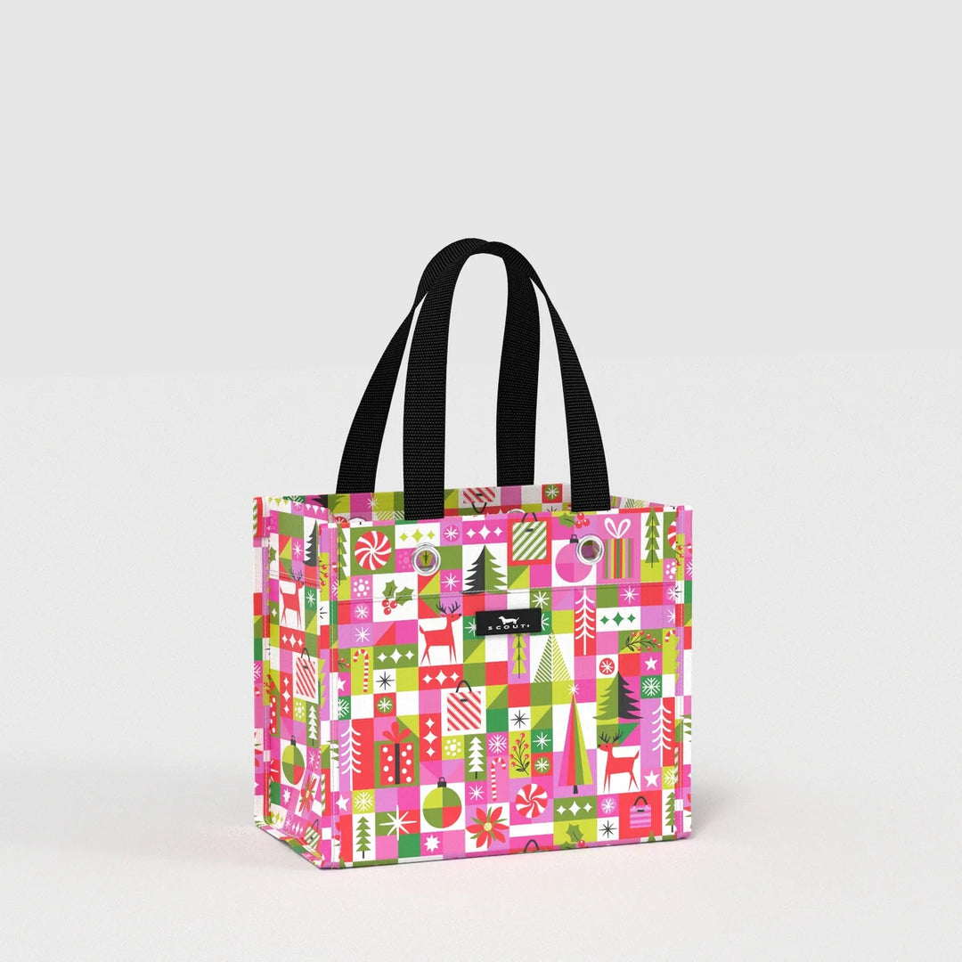 A square tote bag with a vibrant Christmas-themed pattern featuring pink, green, and red holiday motifs, complete with black shoulder straps, set against a plain light gray background.