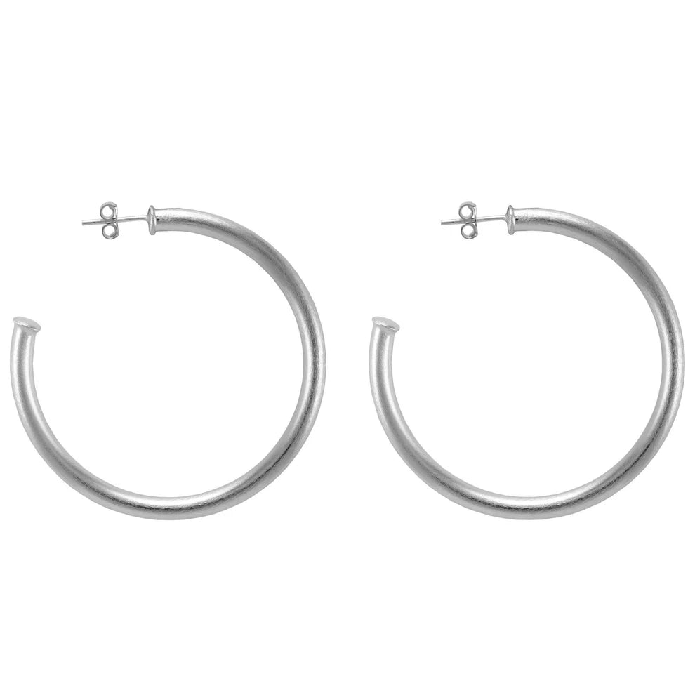 Silver hoop earrings on a white background