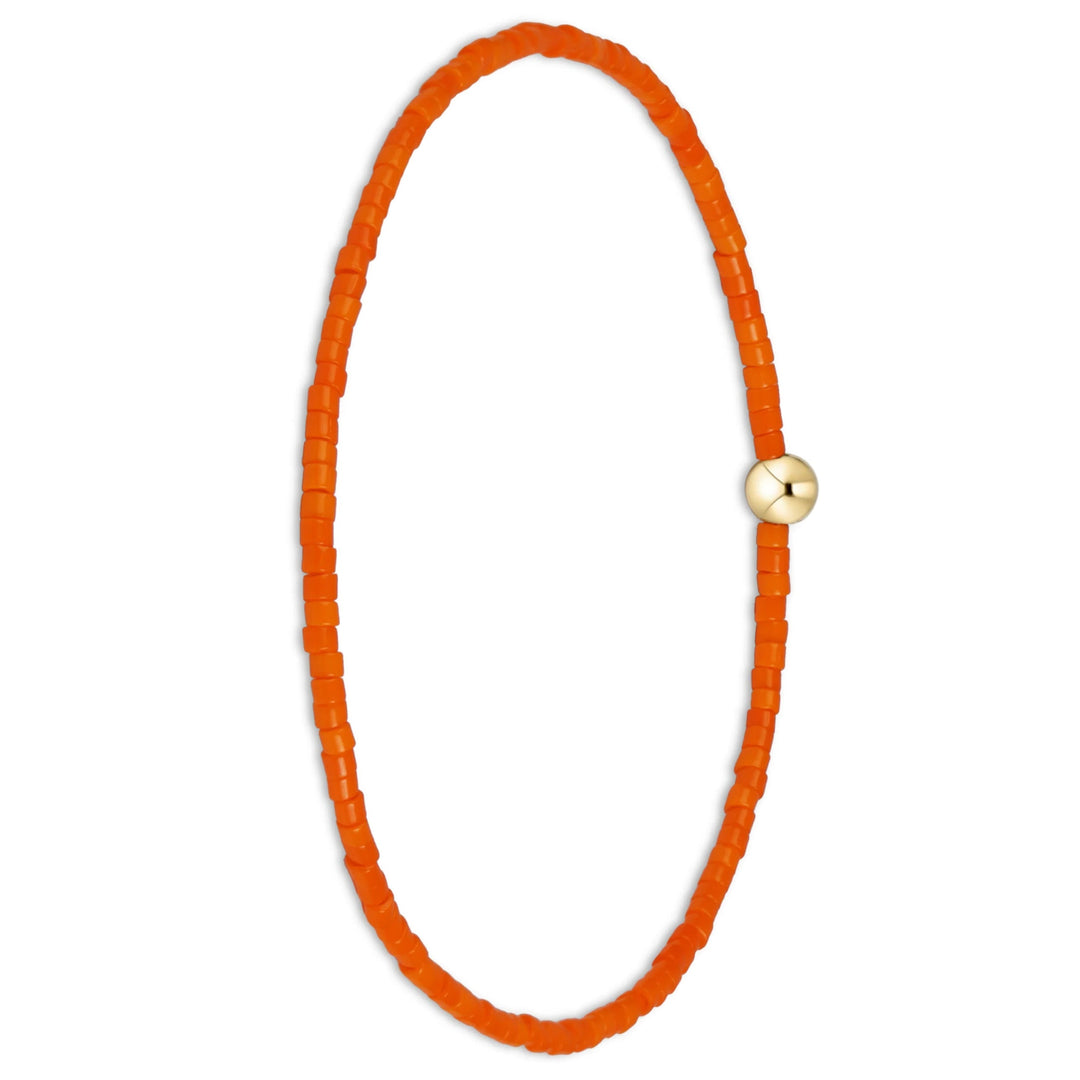 An orange beaded bracelet with a small gold-toned round clasp, displayed on a clean white background.