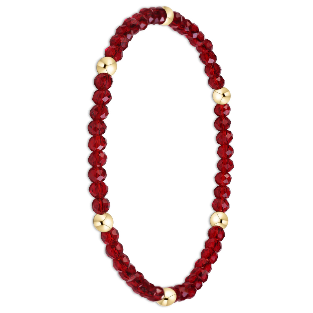 A beaded stretch bracelet featuring faceted deep red beads and polished gold spacer beads, displayed on a clean white background.