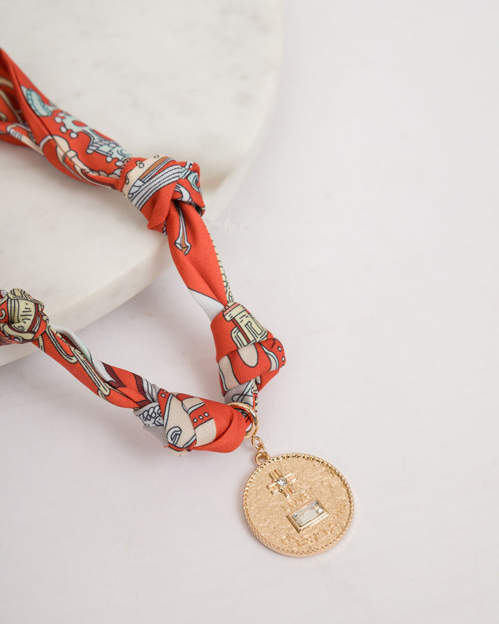 Orange Knotted Scarf Necklace with Coin Pendant