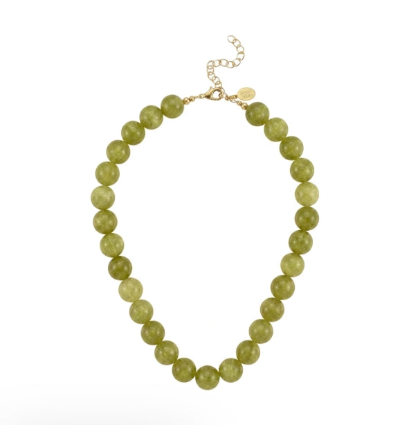 A beaded necklace made of olive green faceted beads with a gold-tone clasp and extender chain, displayed on a clean white background.