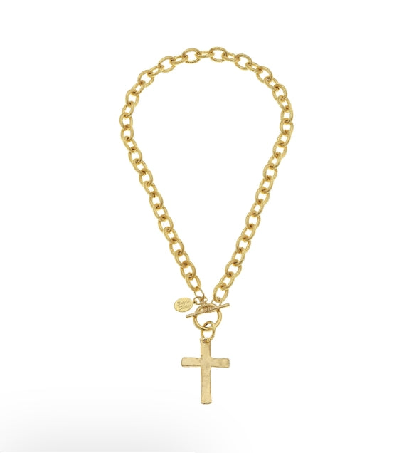 A gold chain bracelet with a cross pendant and a small round charm, displayed on a clean white background.