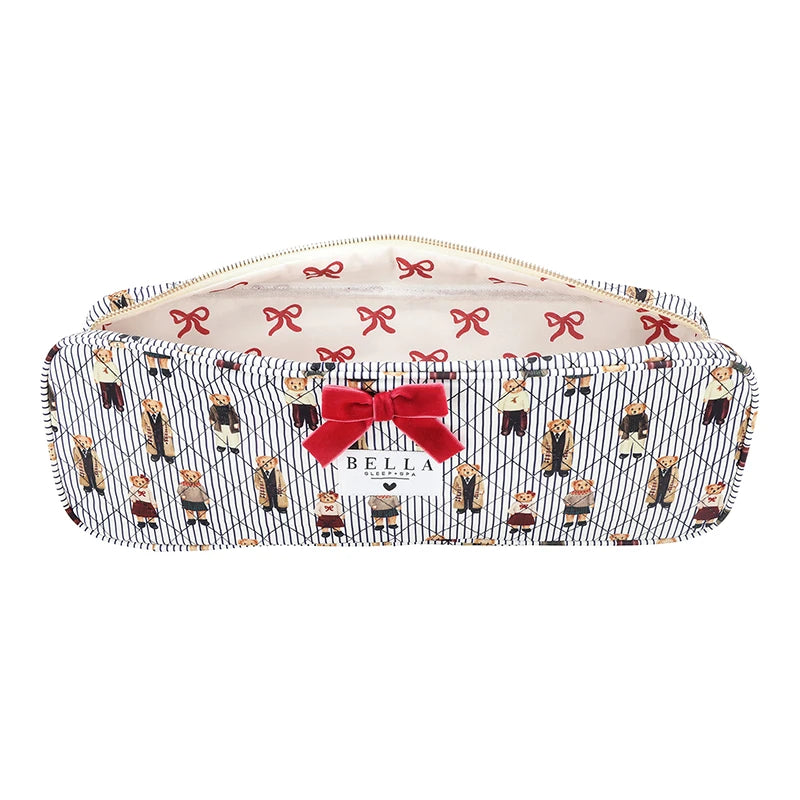 A rectangular zippered pouch with a navy and white diagonal stripe pattern, decorated with a repeating print of cartoon characters in black and red outfits, accented by a red bow on the front and a cream-colored interior lining with red bows.