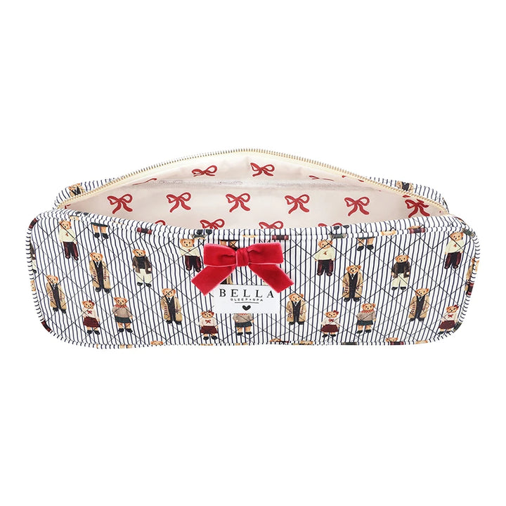 A rectangular zippered pouch with a navy and white diagonal stripe pattern, decorated with a repeating print of cartoon characters in black and red outfits, accented by a red bow on the front and a cream-colored interior lining with red bows.