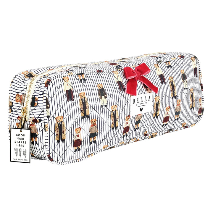 A long rectangular zippered pouch with a white and navy striped background and an all-over print of teddy bears in vintage outfits. The pouch has a gold zipper, a red ribbon bow, a Bella Collection tag, and a small white insert card.