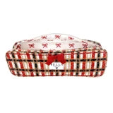 A small rectangular pet bed with a red and white plaid pattern, white stars, and a red bow on the front, shown against a plain white background.
