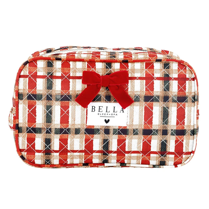 A red, beige, and black plaid zippered cosmetic bag with a red bow and a white Bella Sleep Spa label on the front, set against a plain white background.