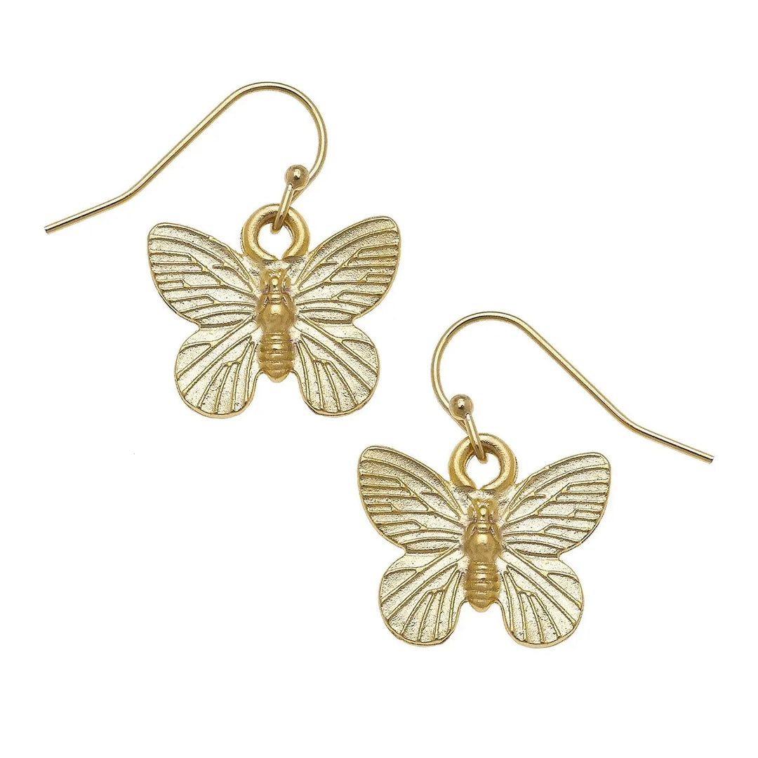 A pair of gold butterfly drop earrings with textured wings and fishhook wires, shown on a plain white background.