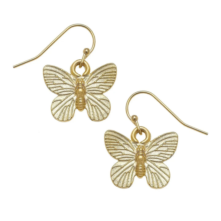 A pair of gold butterfly drop earrings with textured wings and fishhook wires, shown on a plain white background.
