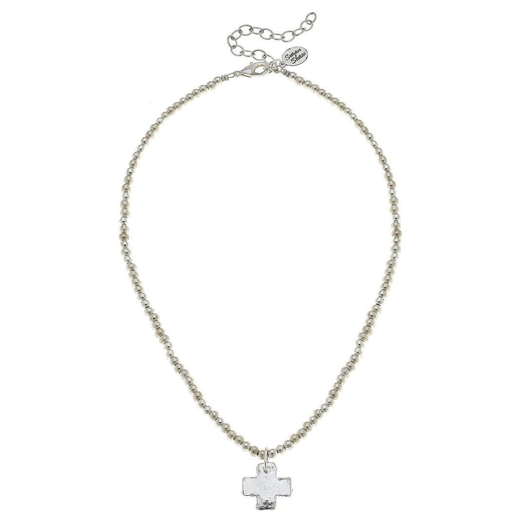 A silver chain necklace with a small cross pendant, displayed on a clean white background.