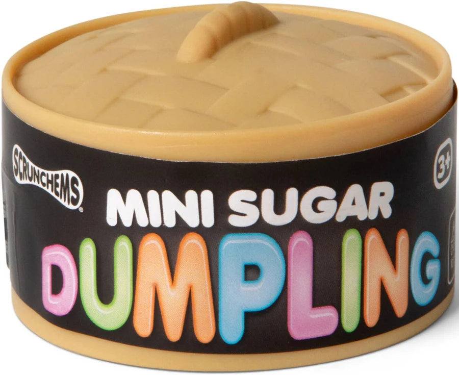 A container of Scrunchems Mini Sugar Dumpling snack, featuring a beige plastic dumpling lid with a handle and a black label with colorful text.