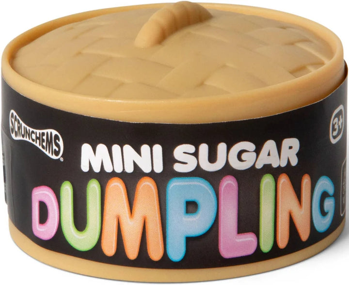 A container of Scrunchems Mini Sugar Dumpling snack, featuring a beige plastic dumpling lid with a handle and a black label with colorful text.